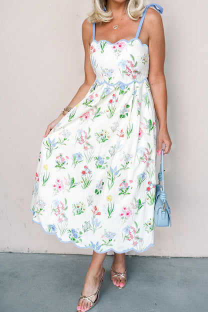 Roze midi-jurk met bloemenprint contrasterende bies strikbandjes en hoge taille