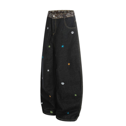 Jeans met gebogen mes vorm en geborduurd sterrenhemelmotief