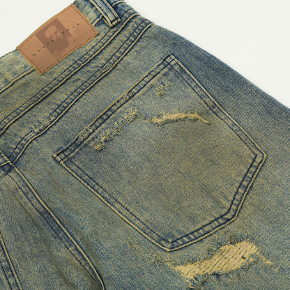 Scratching ripped jeans