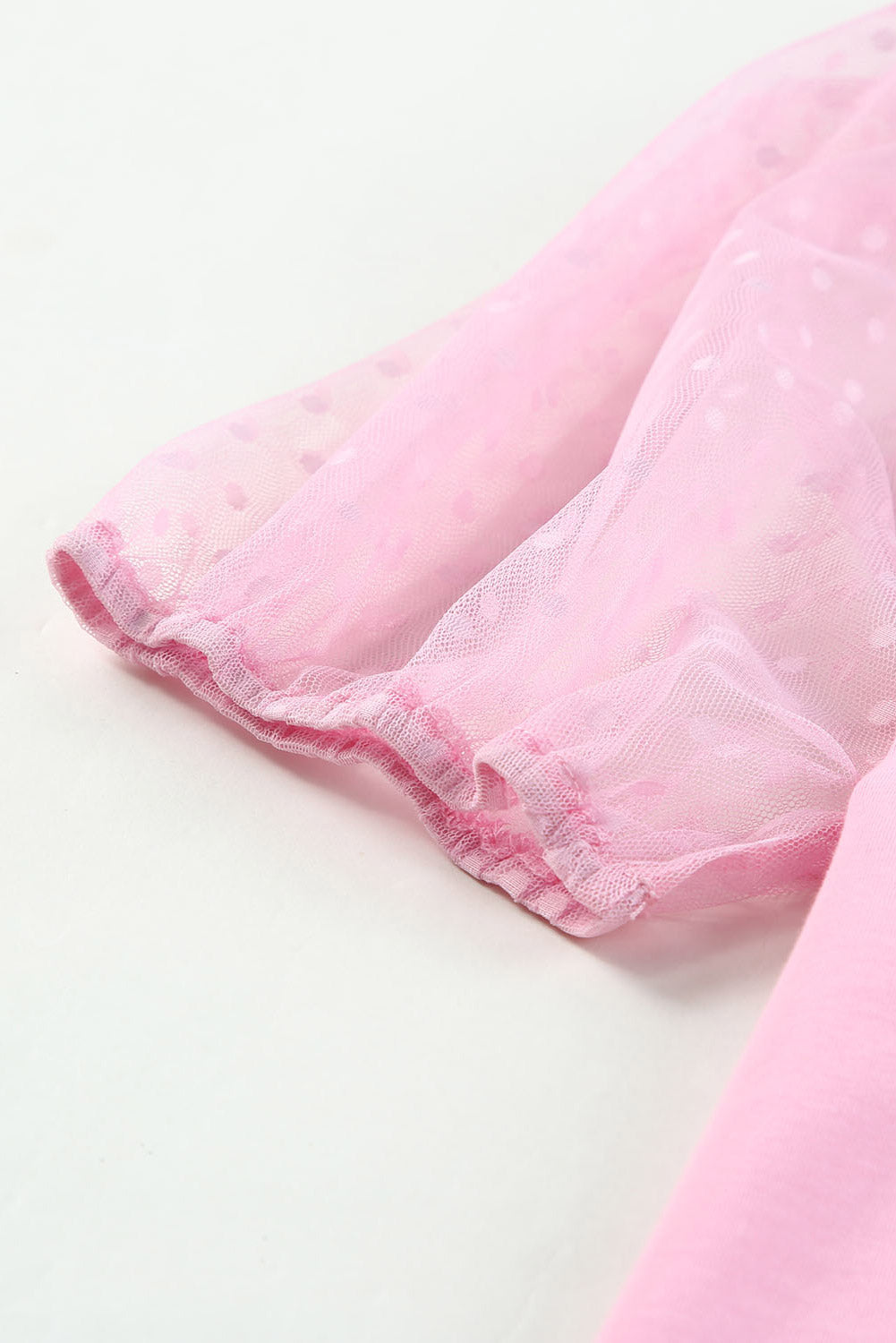 Roze top van tule met pofmouwen