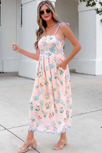 Roze midi-jurk met bloemenprint contrasterende bies strikbandjes en hoge taille