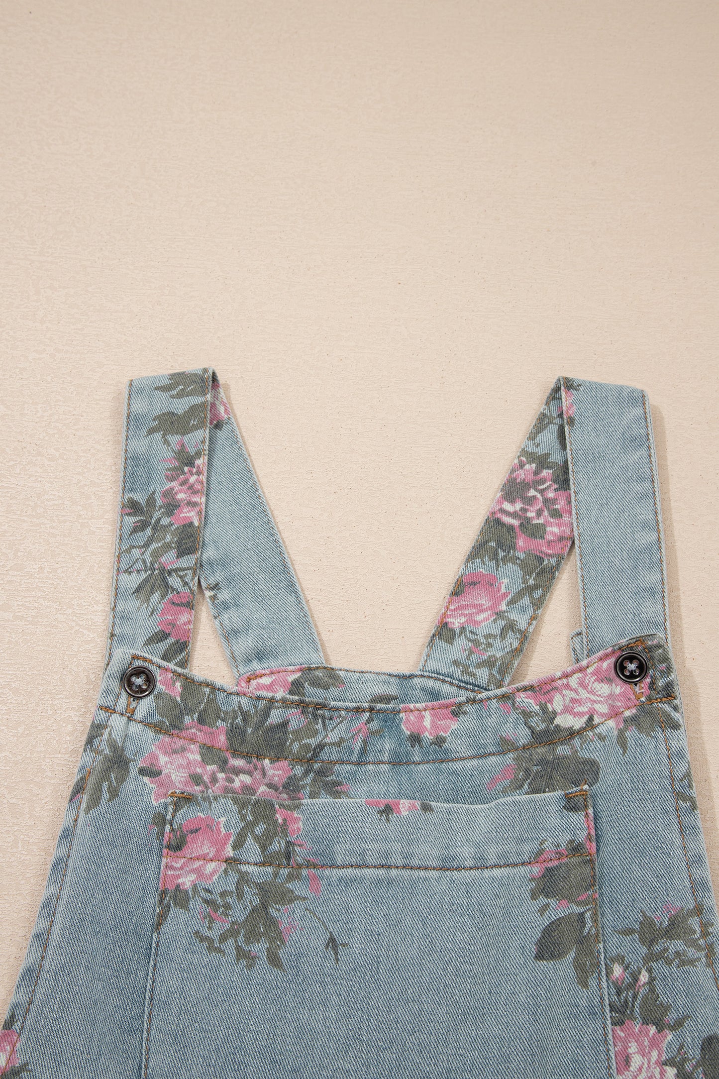 Jumpsuit van denim met bloemenprint zakken geplooide details hoge taille en wijde pijpen