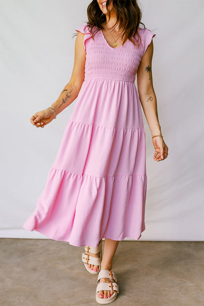 Roze midi-jurk met geplooide top wijd uitlopende mouwen en ruches