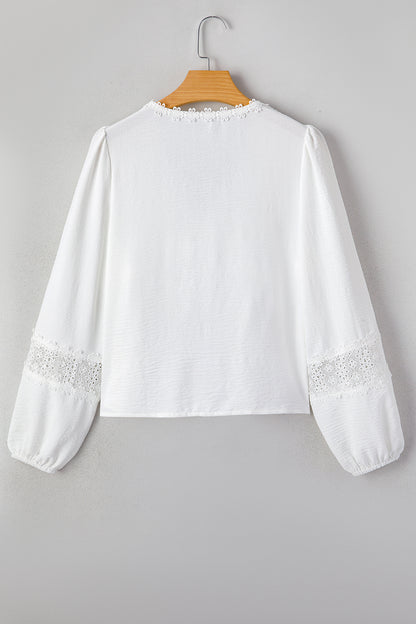 Witte blouse met lange mouwen bloemenmotief guipure kant en ruches
