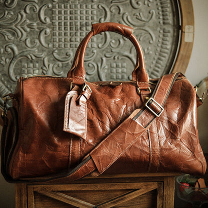 A men's hand-held outdoor camping travel bag made of cowhide