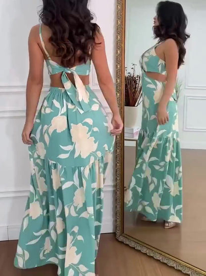 Mouwloze jurk met resortprint en uitsparingen