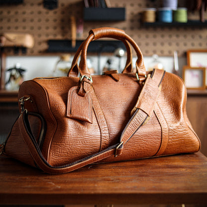 A men's hand-held outdoor camping travel bag made of cowhide