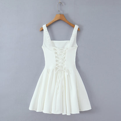 Spicy girl with shoulder straps and pleated dress
