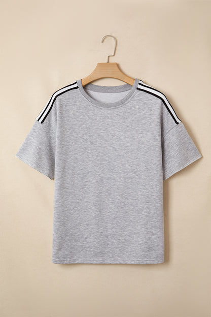 Lichtgrijze oversized T-shirt met patchworkdetails en onafgewerkte randen