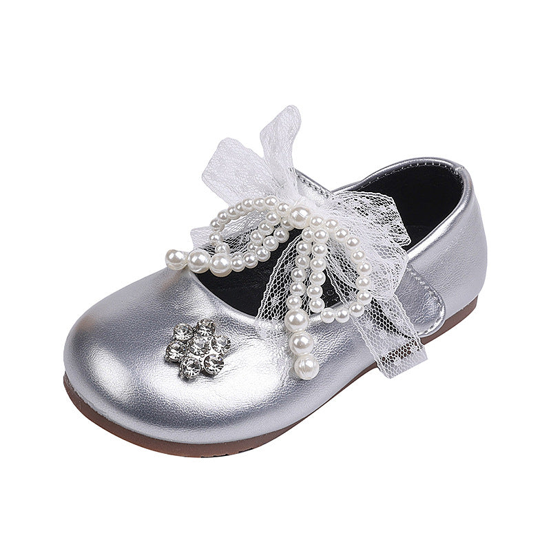Sweet bow-adorned little leather shoes