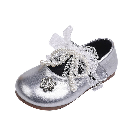 Sweet bow-adorned little leather shoes