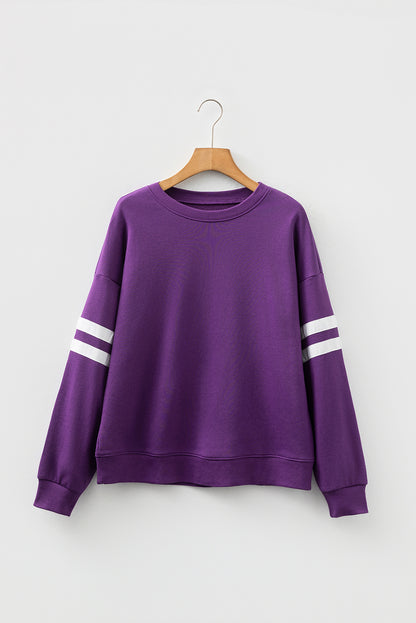 Preppy sweatshirt met strepen op de mouwen en een losse pasvorm