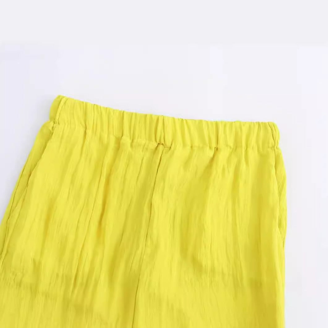 Gele wijde broek met zakken en elastische taille