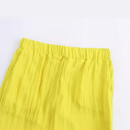 Gele wijde broek met zakken en elastische taille