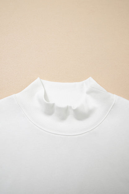 Effen top met hoge hals en korte mouwen osvallend model