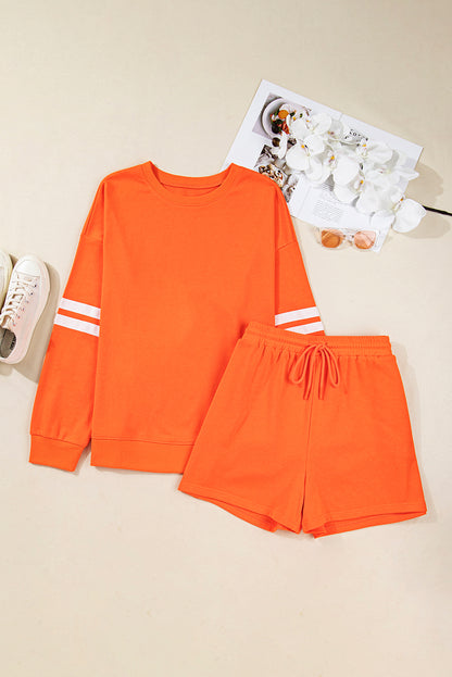 Oranje plus size sweatshirt met varsity-strepen op de mouwen en bijpassende shorts