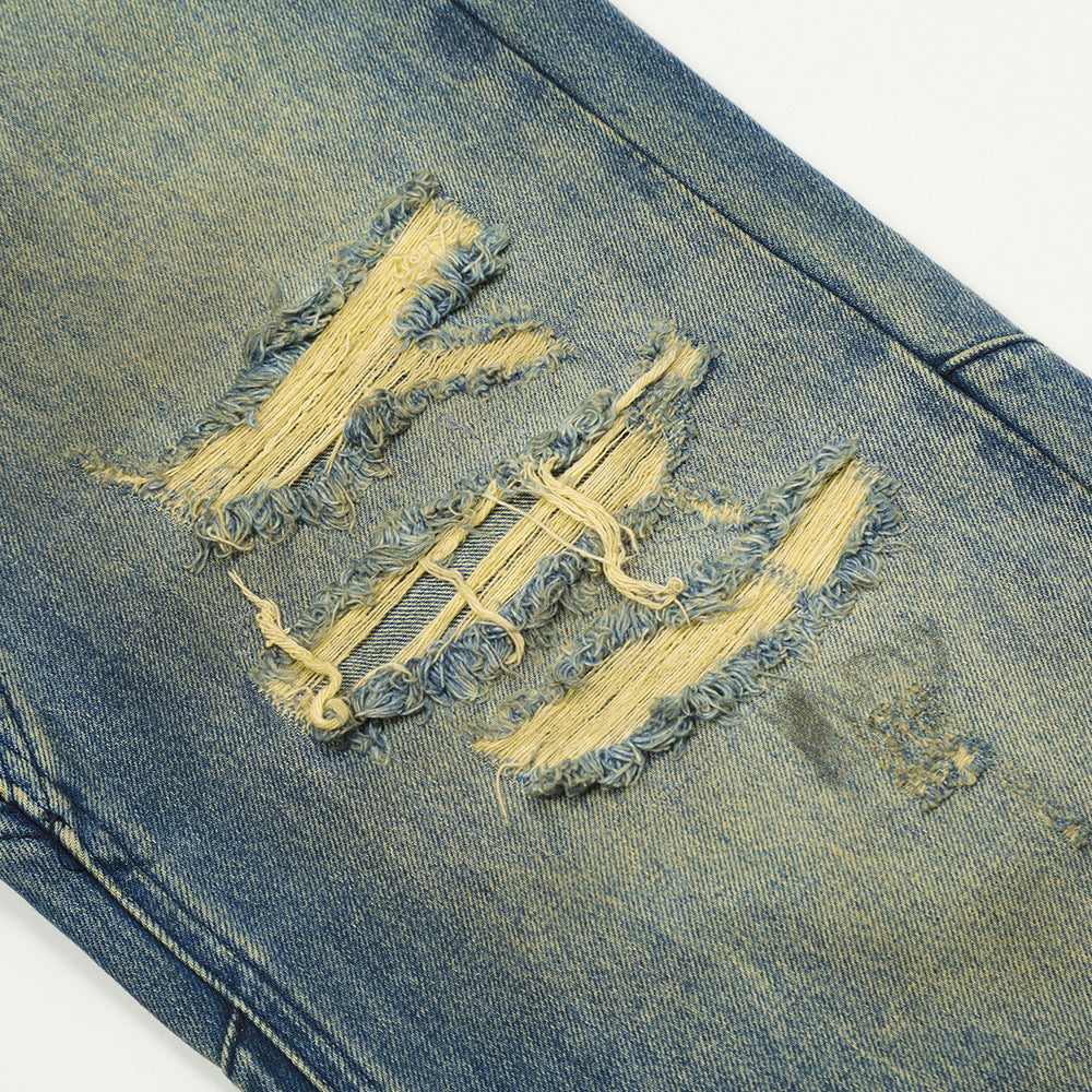 Scratching ripped jeans