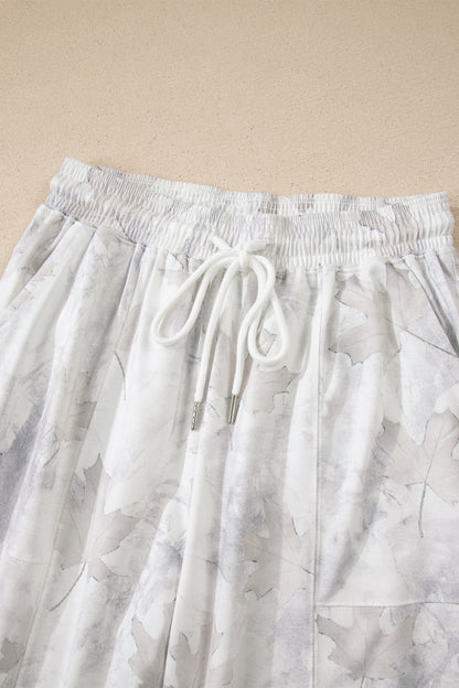 Beige joggingbroek met camouflageprint wijde pijpen en trekkoord