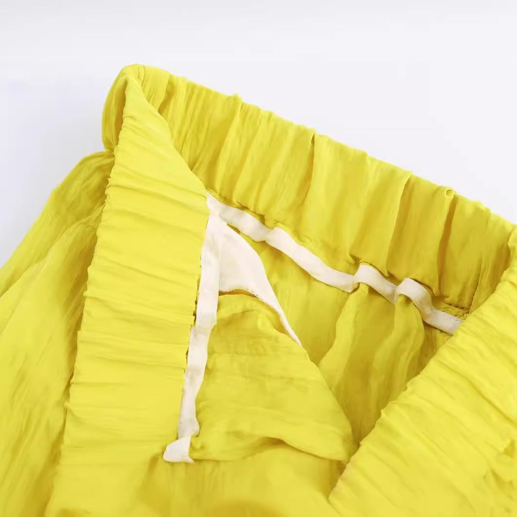 Gele wijde broek met zakken en elastische taille