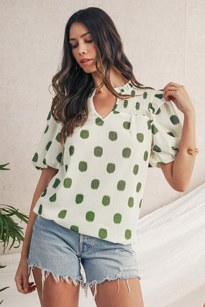 Blouse met stippenprint gesmokte halslijn en korte ballonmouwen