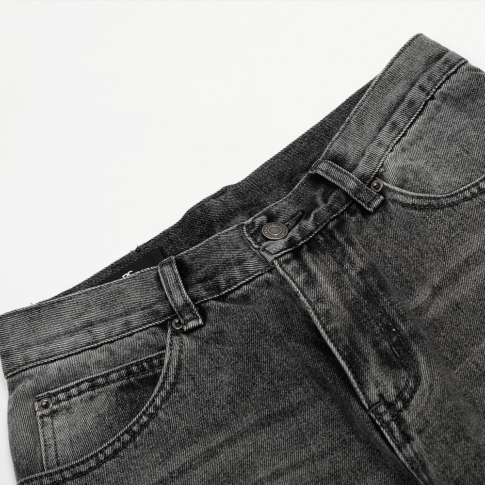 Washed and ground white distressed jeans