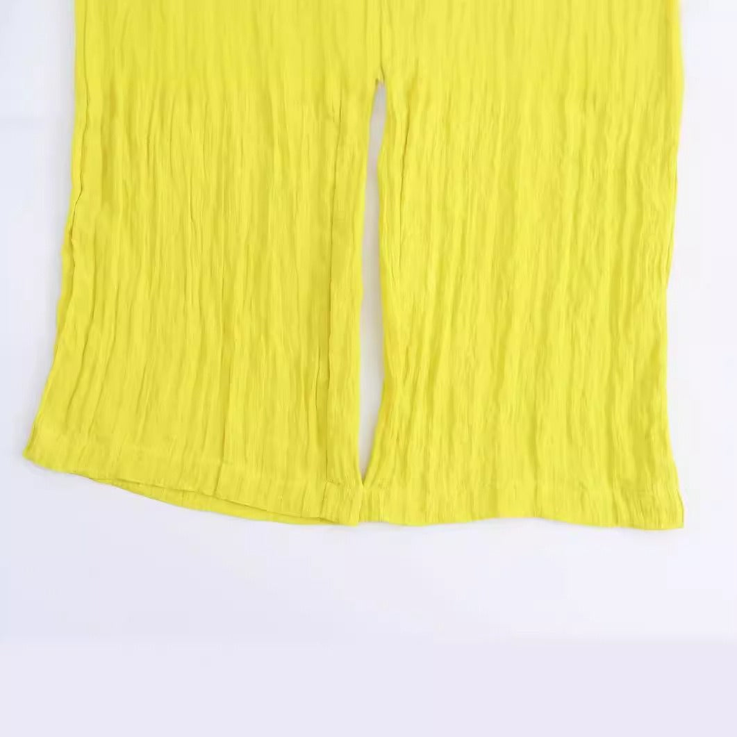 Gele wijde broek met zakken en elastische taille