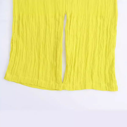 Gele wijde broek met zakken en elastische taille
