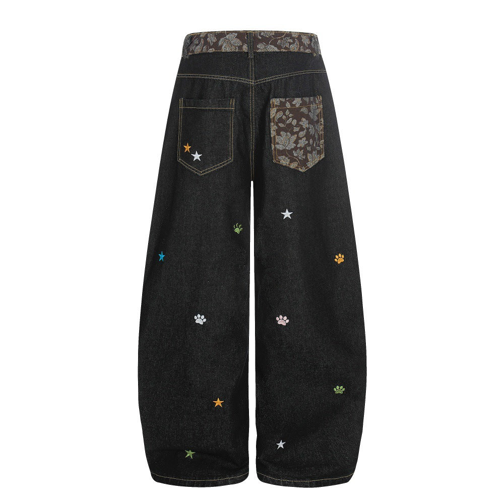 Jeans met gebogen mes vorm en geborduurd sterrenhemelmotief