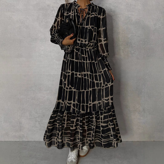 Elegante jurk met lange mouwen print getailleerde pasvorm en uitlopende rok