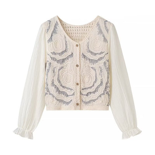 Damesblouse uit de lentecollectie: vintage jacquard blouse met opengewerkt design
