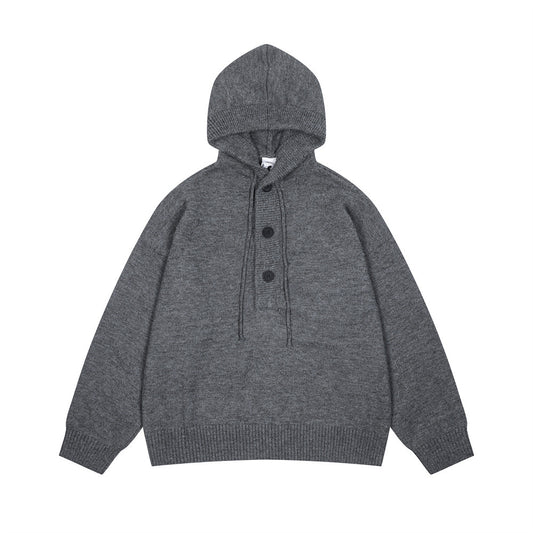 Tui met halve knoopsluiting en capuchon