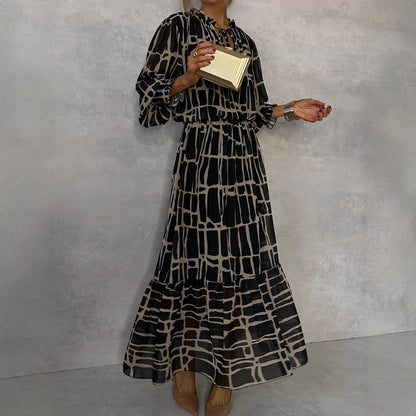 Elegante jurk met lange mouwen print getailleerde pasvorm en uitlopende rok