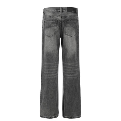 Washed and ground white distressed jeans