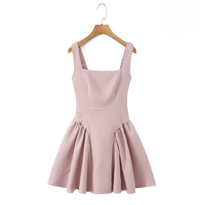 Spicy girl with shoulder straps and pleated dress