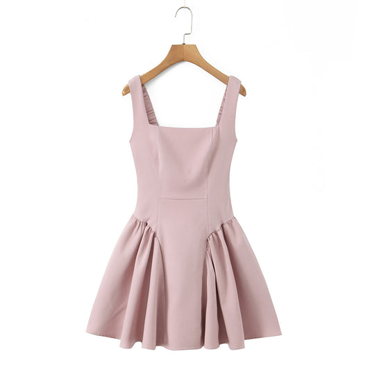 Spicy girl with shoulder straps and pleated dress