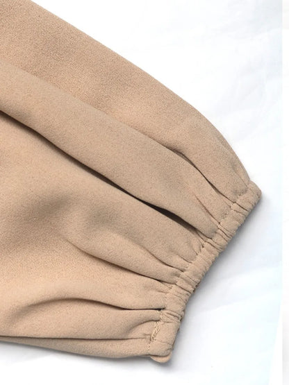 Mooie blouse met ruches strik bij de hals en lange pofmouwen