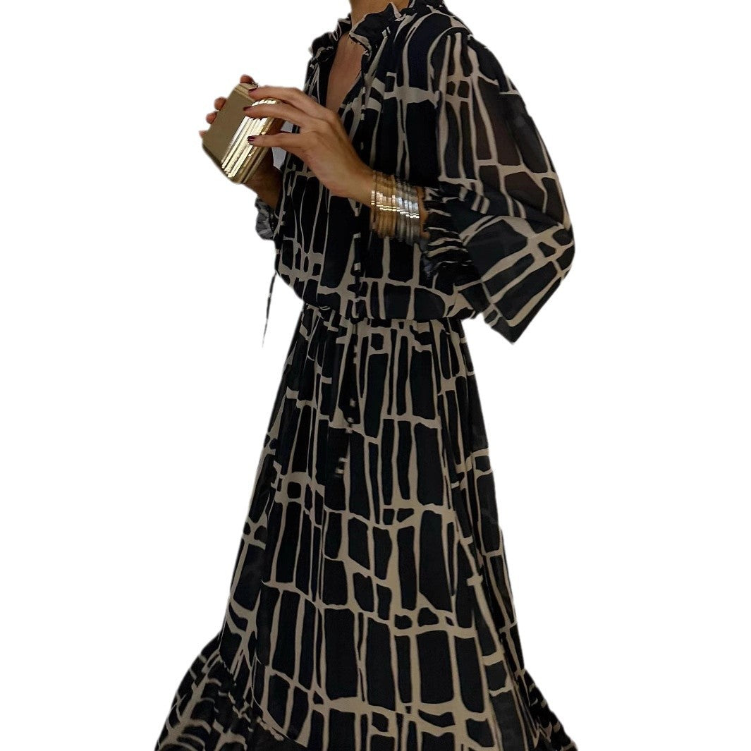 Elegante jurk met lange mouwen print getailleerde pasvorm en uitlopende rok