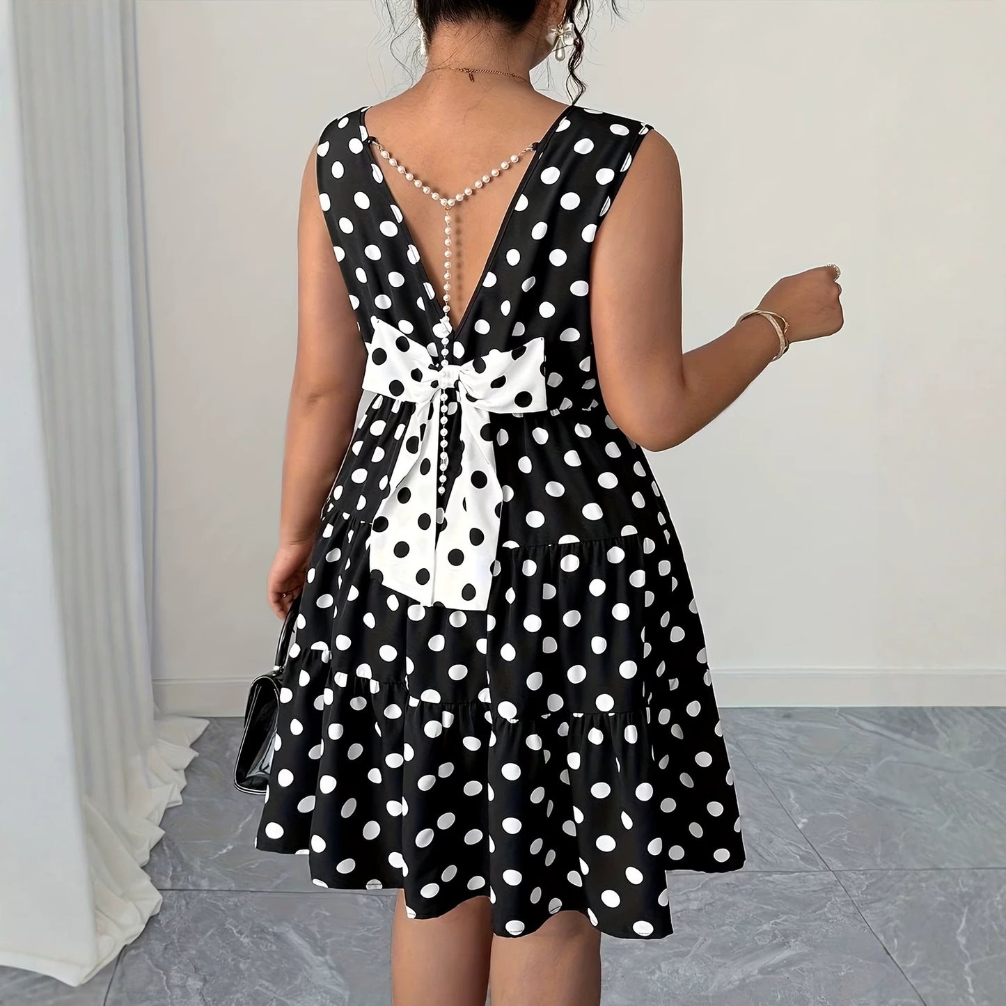 Plus size retro mouwloze jurkje  met parels stippenprint en strik