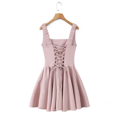 Spicy girl with shoulder straps and pleated dress