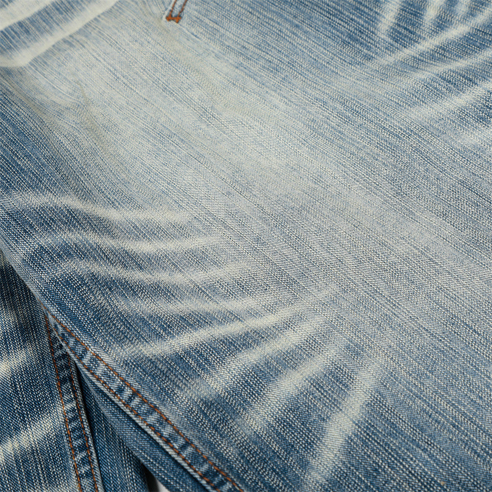Witgewassen denim jeans in gebogen mes vorm