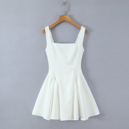 Spicy girl with shoulder straps and pleated dress