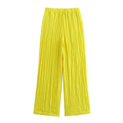 Gele wijde broek met zakken en elastische taille