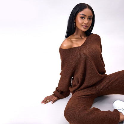 Gebreid geborsteld pak met lange mouwen en verzonken strepen