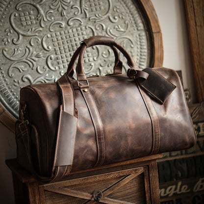 A men's hand-held outdoor camping travel bag made of cowhide