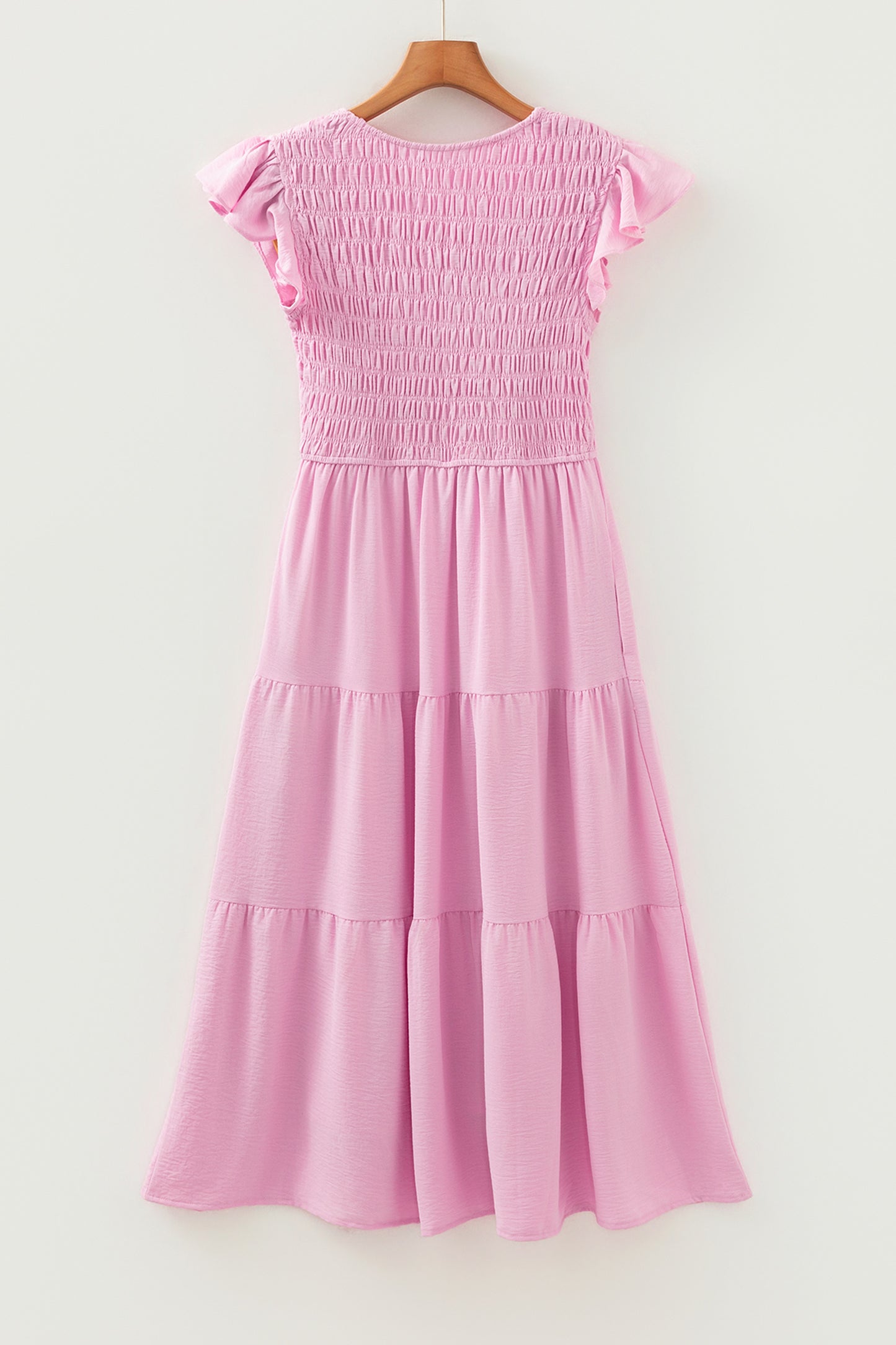 Roze midi-jurk met geplooide top wijd uitlopende mouwen en ruches
