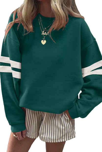 Preppy sweatshirt met strepen op de mouwen en een losse pasvorm