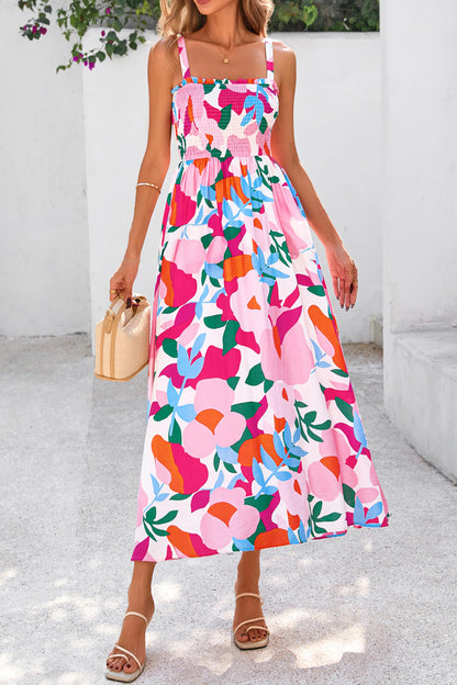 Roze zomerjurk met bloemenprint verstelbare bandjes smokwerk en hoge taille