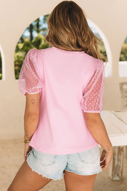 Roze top van tule met pofmouwen
