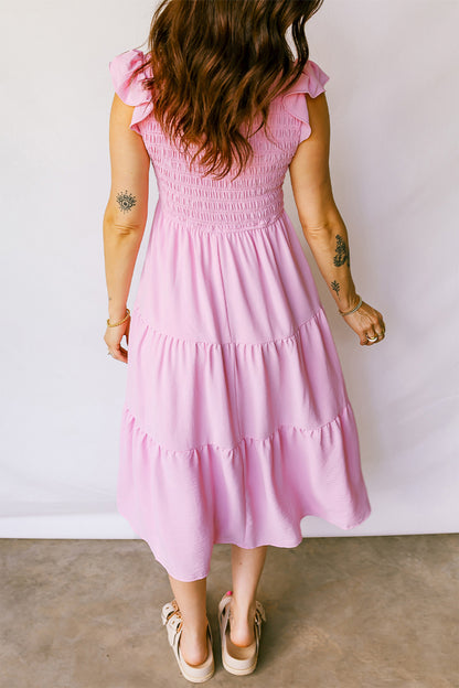 Roze midi-jurk met geplooide top wijd uitlopende mouwen en ruches