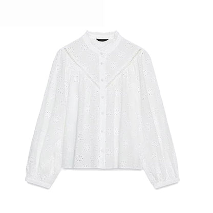 Damesblouse met opengewerkte borduursels
